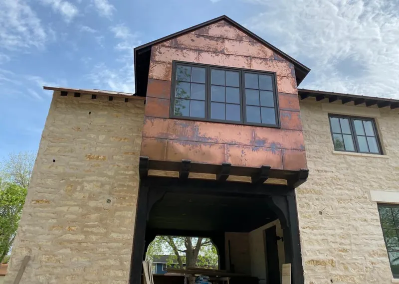 Copper metal panel facade on a stone building for Skylight Installation in Lower Swatara